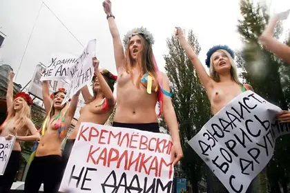 Putin triggers topless protest, speculation over his appearance