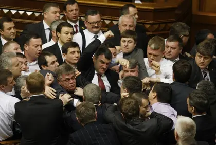 Ukraine parliament reopens after four weeks, but fists fly again