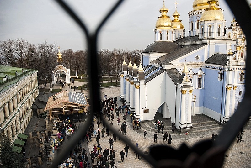 Back to the Middle Ages on the way to Europe: Beaten Kyiv protesters take refuge in ancient church yard