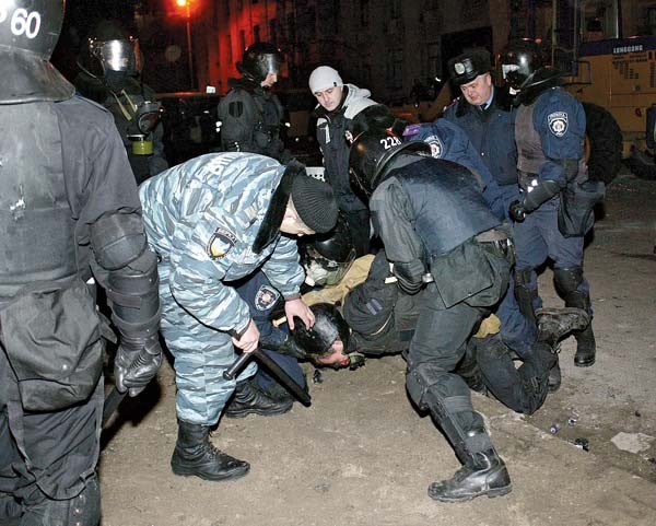 Kyiv’s riot police brutal, ‘begrudging’