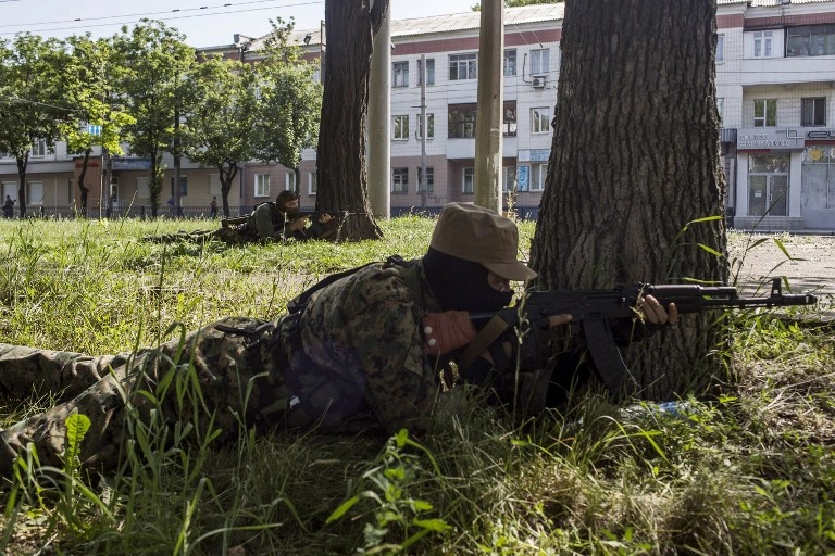 Separatist leader says six insurgents killed in attempt to collect bodies at Donetsk airport; military says they attacked