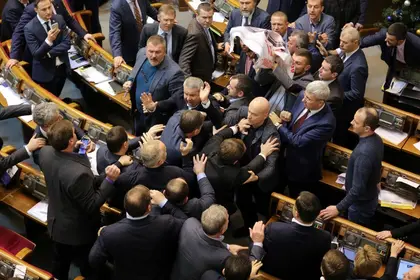 Ukraine passes law forcing Moscow-backed church to identify as Russian; fight erupts in parliament