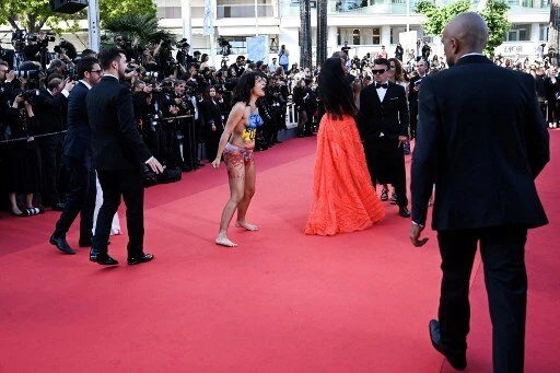 Nude Activist Stages Lone Cannes Protest In Support of Ukrainian Women