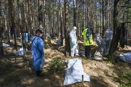 Ukraine Says 447 Bodies Exhumed at Izyum, 30 with “Signs of Torture”