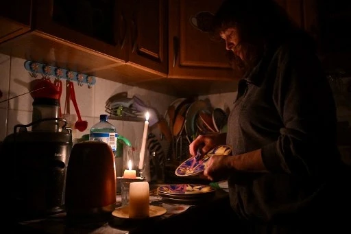 Defiance by Candlelight as Kyiv Adapts to Blackouts