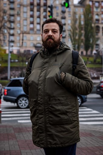 Denys, 30, poses in Kyiv on November 8, 2022, amid the Russian military invasion of Ukraine. &#8211; &#8220;National influencer&#8221; Ukrainian President Volodymyr Zelensky set the trend by wearing khaki outfits in every setting since the beginning of the Russian invasion in February. In the eight months of war, his people followed suit. (Photo by Dimitar DILKOFF / AFP)
