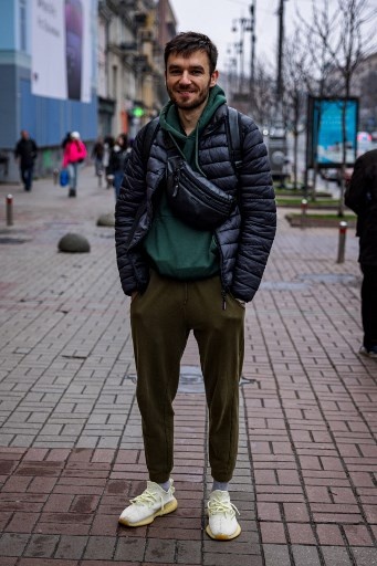 Igor, 26, poses in Kyiv on November 8, 2022, amid the Russian military invasion of Ukraine. &#8211; &#8220;National influencer&#8221; Ukrainian President Volodymyr Zelensky set the trend by wearing khaki outfits in every setting since the beginning of the Russian invasion in February. In the eight months of war, his people followed suit. (Photo by Dimitar DILKOFF / AFP)