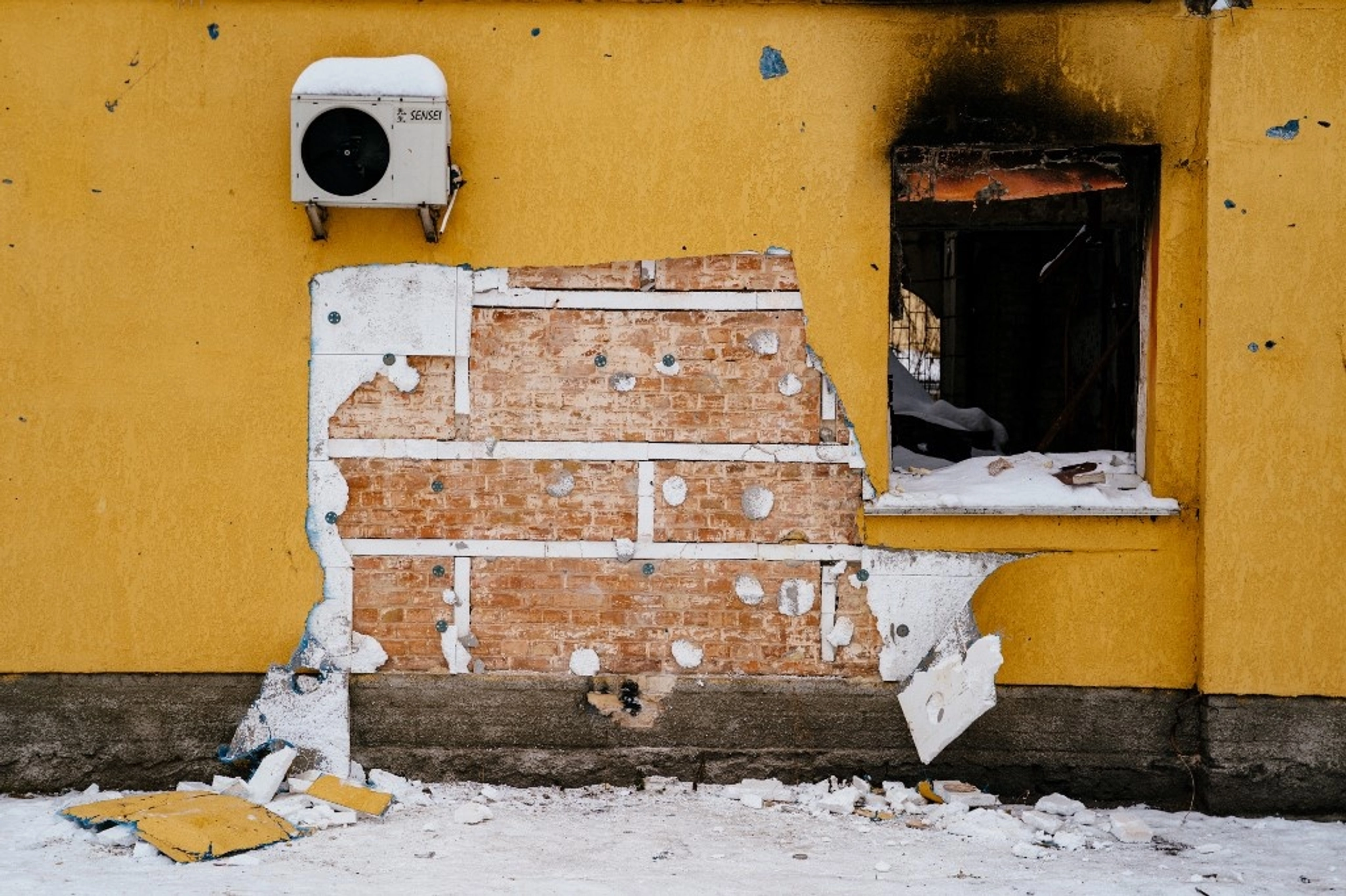 This photograph taken on December 3, 2022 shows a cut off of the wall of a damaged building from where a group people tried to steal a work of the famous British artist Banksy in the town of Gostomel, near Kyiv, amid the Russian invasion of Ukraine. 