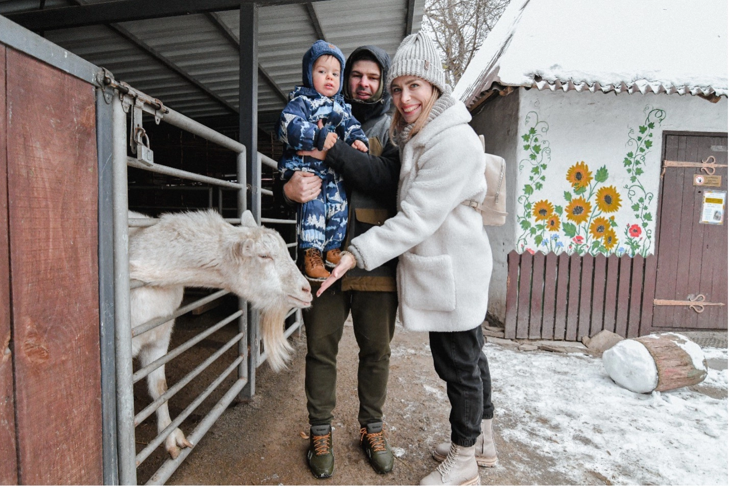 Local family reacts to nanny goat at the petting zoo at Kyiv City Zoo. Dec. 10 photo by Stefan Korshak