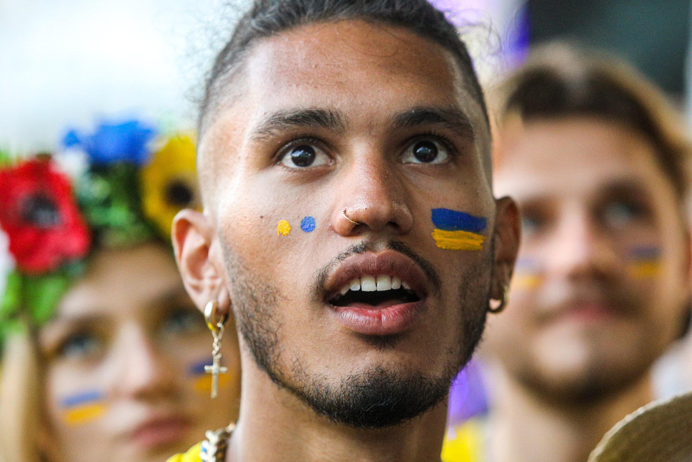Ukrainian supporters  watch the  UEFA EURO 2020 Group C football match between Ukraine and Austria on a giant screen in the center of Kyiv on June 21, 2021.
