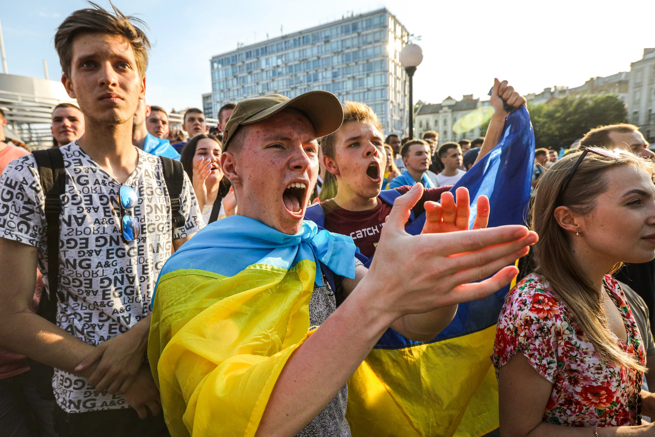 Ukrainian supporters reacts as they watch the  UEFA EURO 2020 Group C football match between Ukraine and Austria on a giant screen in the center of Kyiv on June 21, 2021.