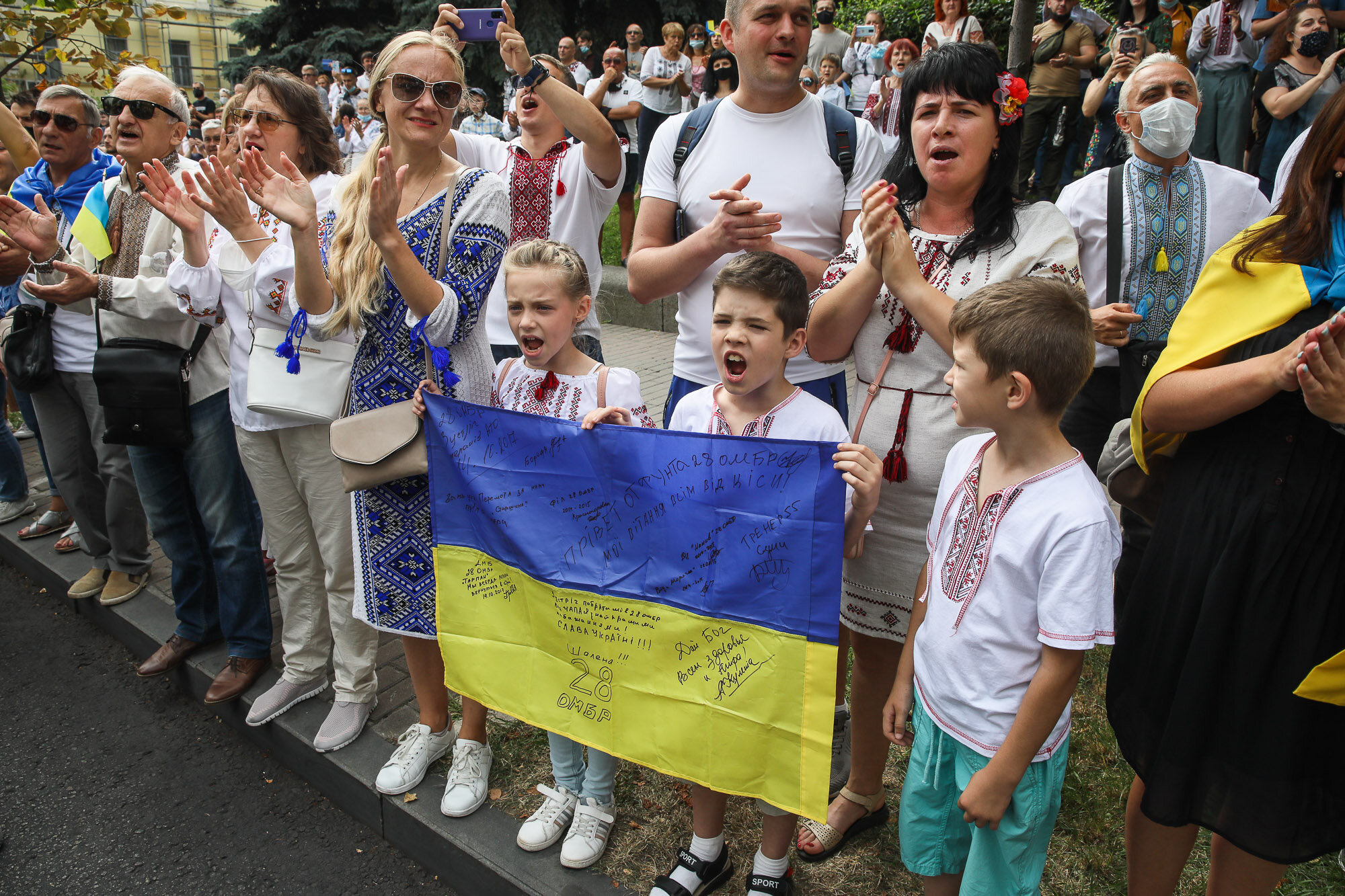 Children chant as Ukrainian veterans and activists participate in the March of Defenders of Ukraine as part of Ukraine&#8217;s Independence Day celebrations in Kyiv on Aug. 24, 2020.