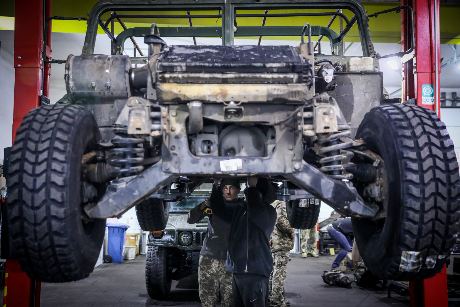Technicians repair a Humvee vehicle at a Ukrainian army&#8217;s maintenance and overhaul workshop in the city of Zhytomyr on Nov. 20, 2020.