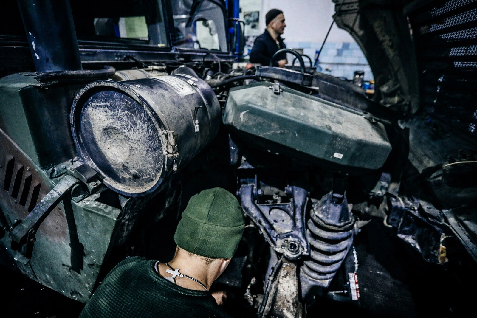 Technicians repair a Humvee vehicle at a Ukrainian army&#8217;s maintenance and overhaul workshop in the city of Zhytomyr on Nov. 20, 2020.