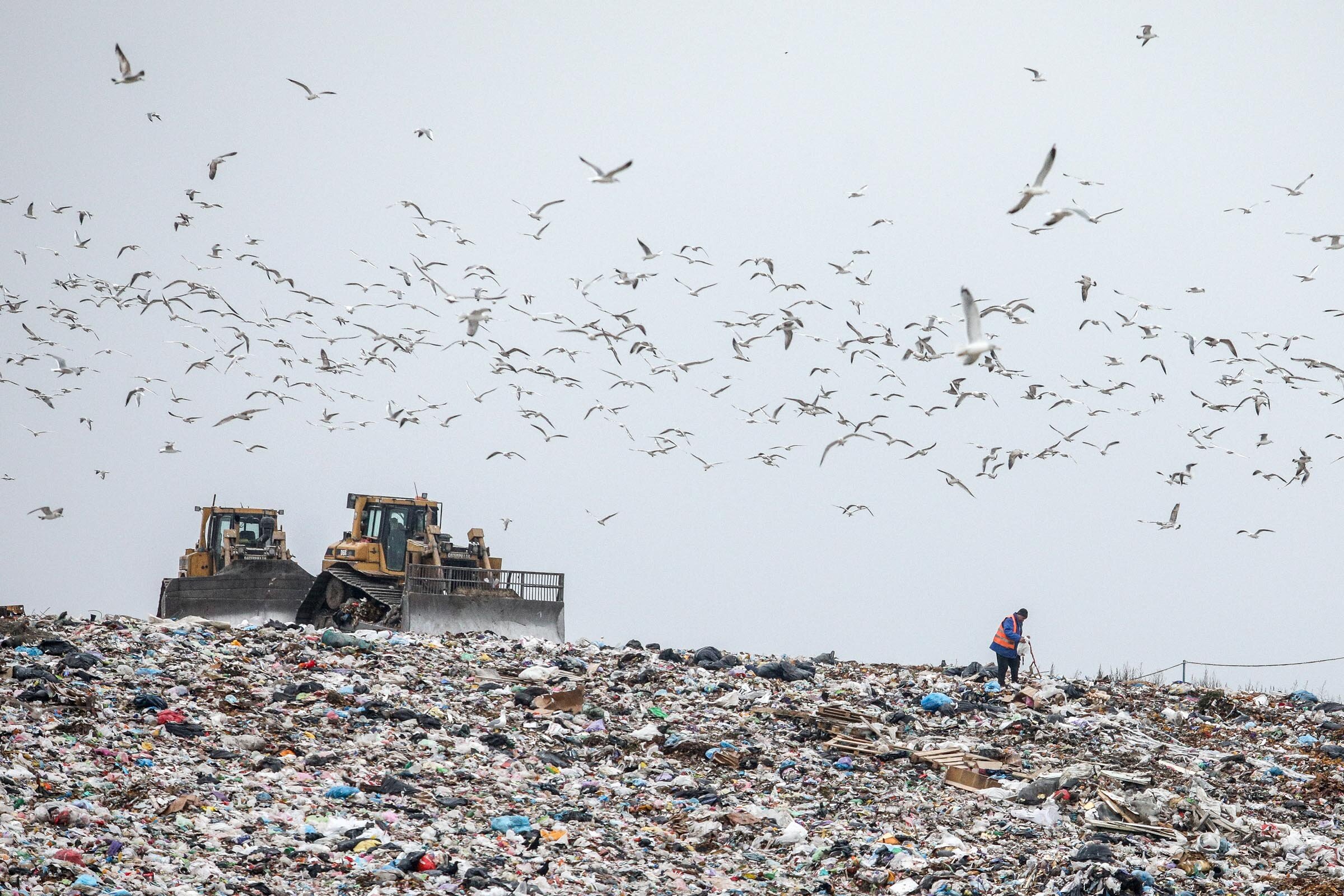 A worker checks the ground at the landfill No. 5 in Pidhirtsi, Kyiv Oblast. 
