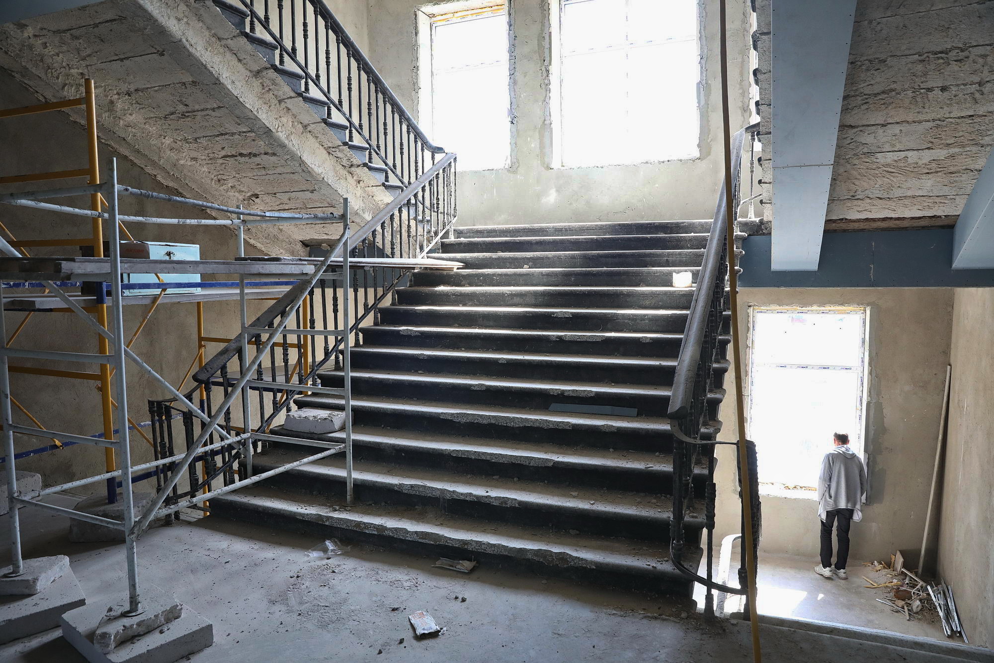 An employee of the Trade Unions House in Odesa stands near the big staircase inside of the building on May 13, 2019. The 42 pro-Russian activists were killed by the fire there on May 2, 2014. The staircase was in the epicenter of that fire.