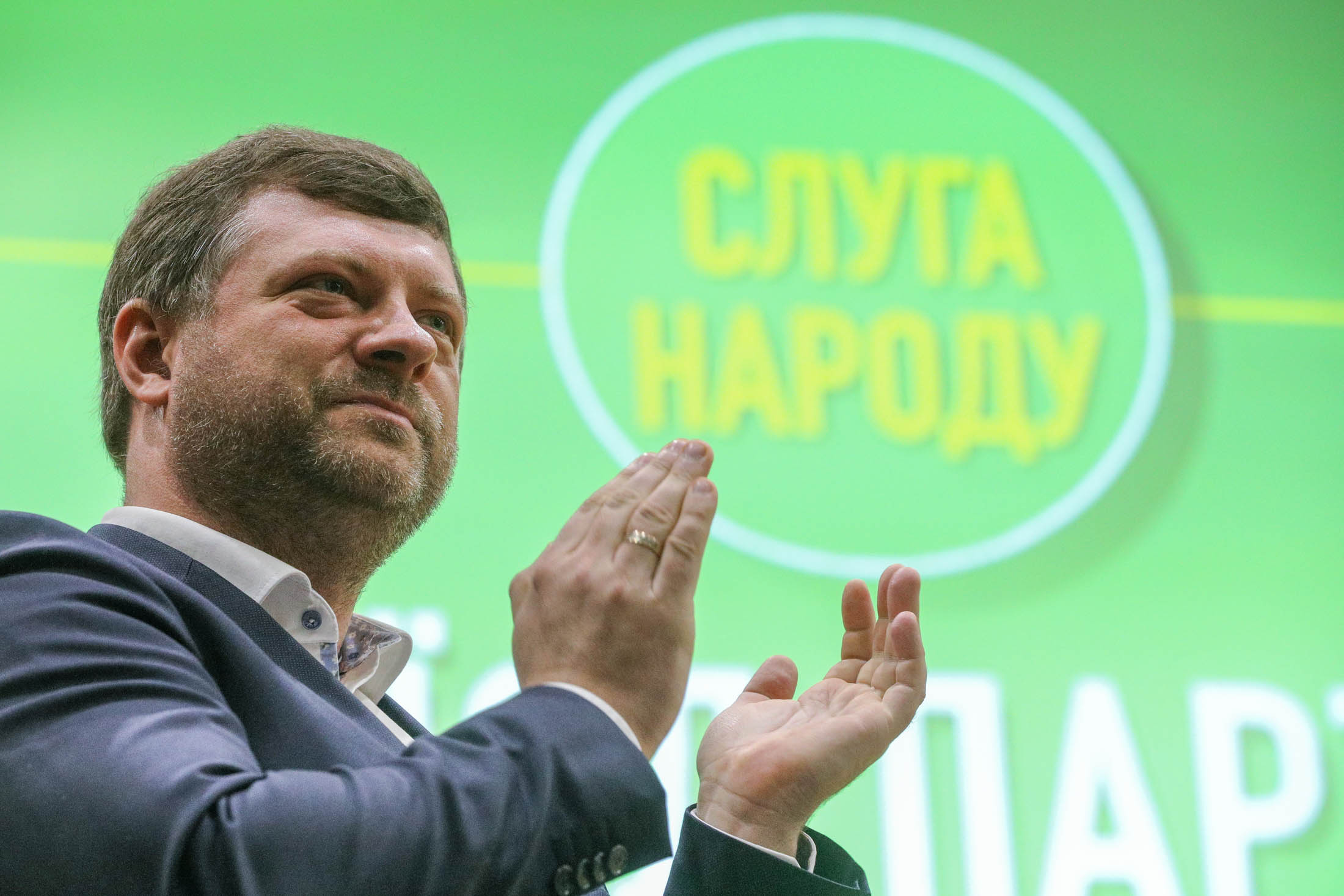 Oleksandr Korniyenko, deputy head of Servant of the People, applauds onstage during the party&#8217;s convention in Kyiv on Feb. 15, 2020.