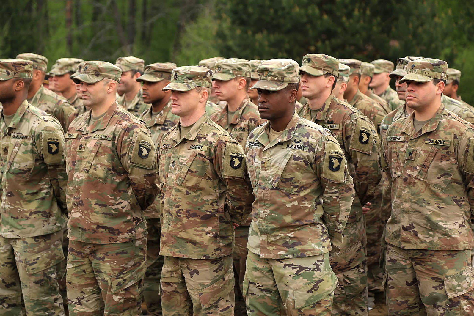 Servicemen of the U.S. Army 101st Division stand in line during the transfer of authority ceremony of the JMTG-U training mission at the Yavoriv training range on May 2, 2019.