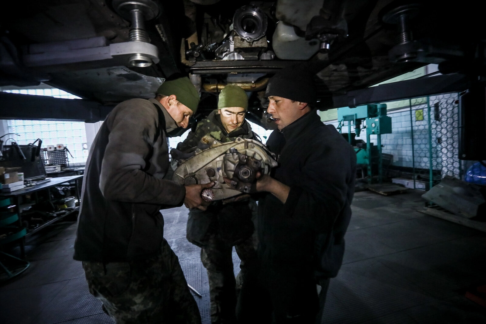 Technicians repair a Humvee vehicle at a Ukrainian army&#8217;s maintenance and overhaul workshop in the city of Zhytomyr on Nov. 20, 2020.