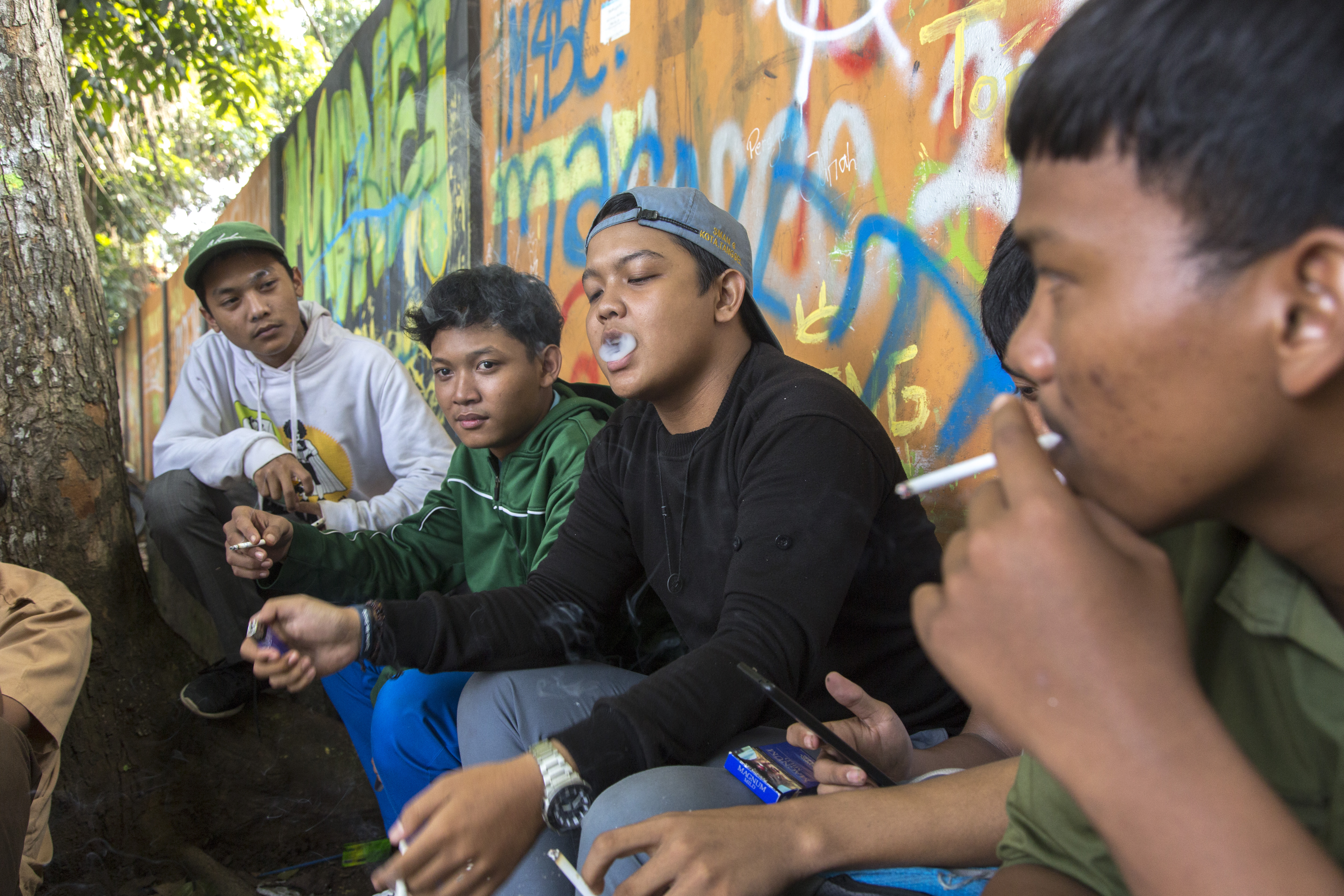 Students hang out after school while smoking cigarretes in Bogor, West Java.