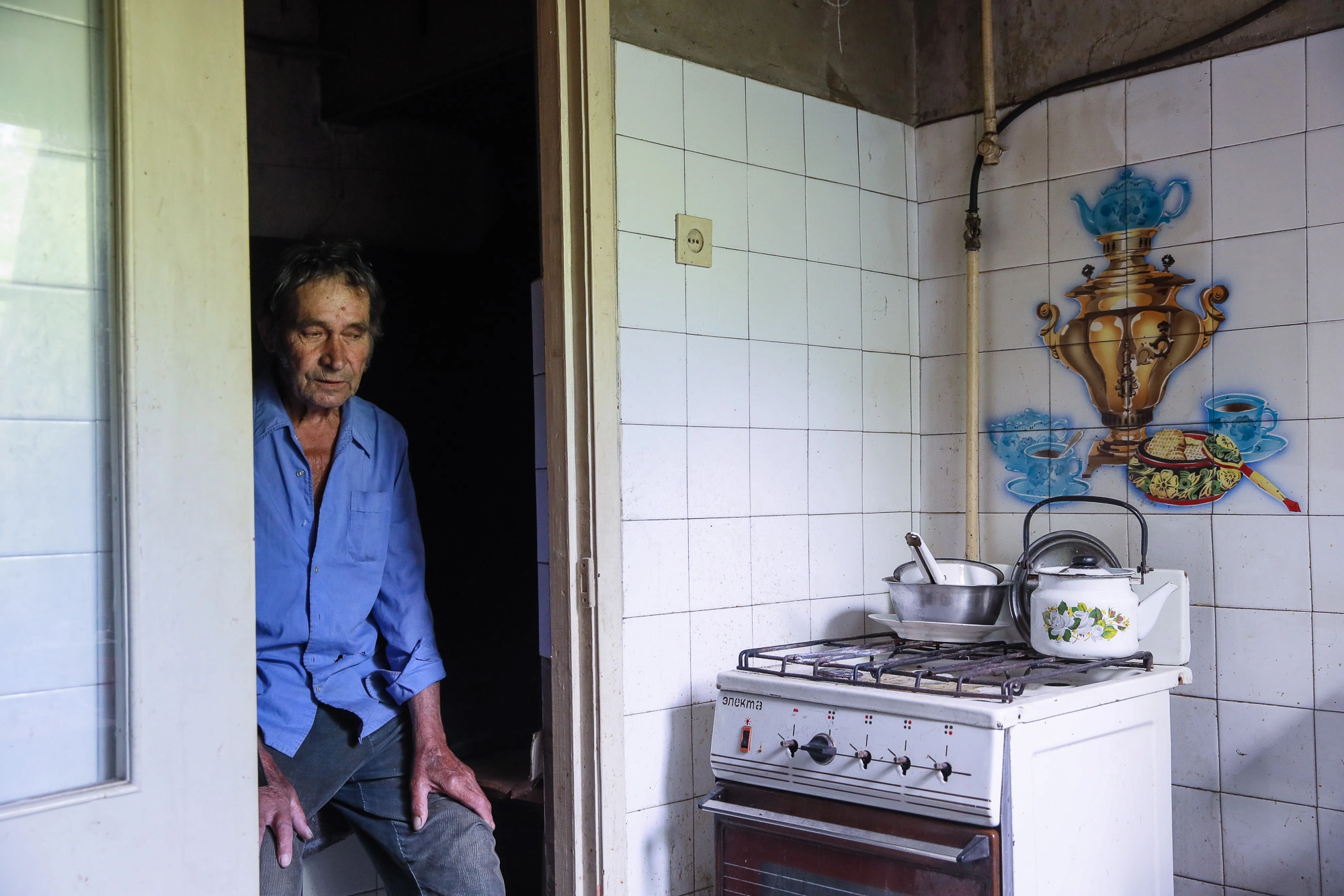 Oleksandr Suprun, a local civilian, sits in a protected shelter in the town of Opytne on June 12, 2019.