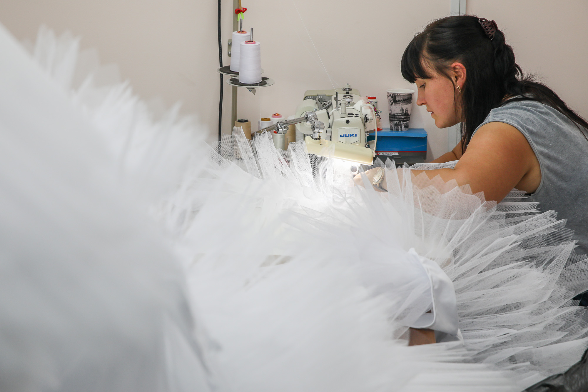 A seamstress works on a new wedding dress. (Volodymyr Petrov)