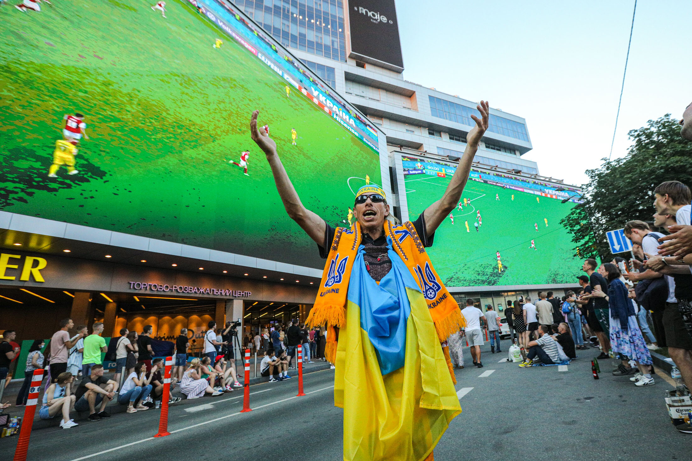 Ukrainian supporter reacts during the UEFA EURO 2020 Group C football match between Ukraine and Austria showing on a giant screen in the center of Kyiv on June 21, 2021.