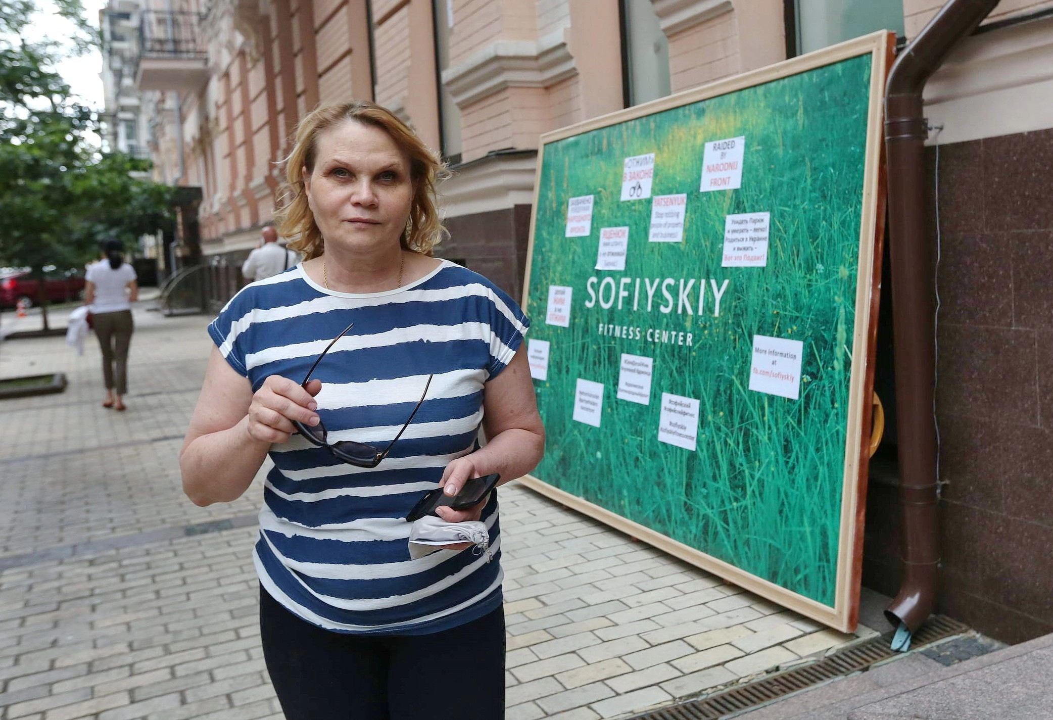 Furniture and gym equipment lies dumped on the back terrace of the Sofiyskiy Fitness Center in Kyiv on June 13.