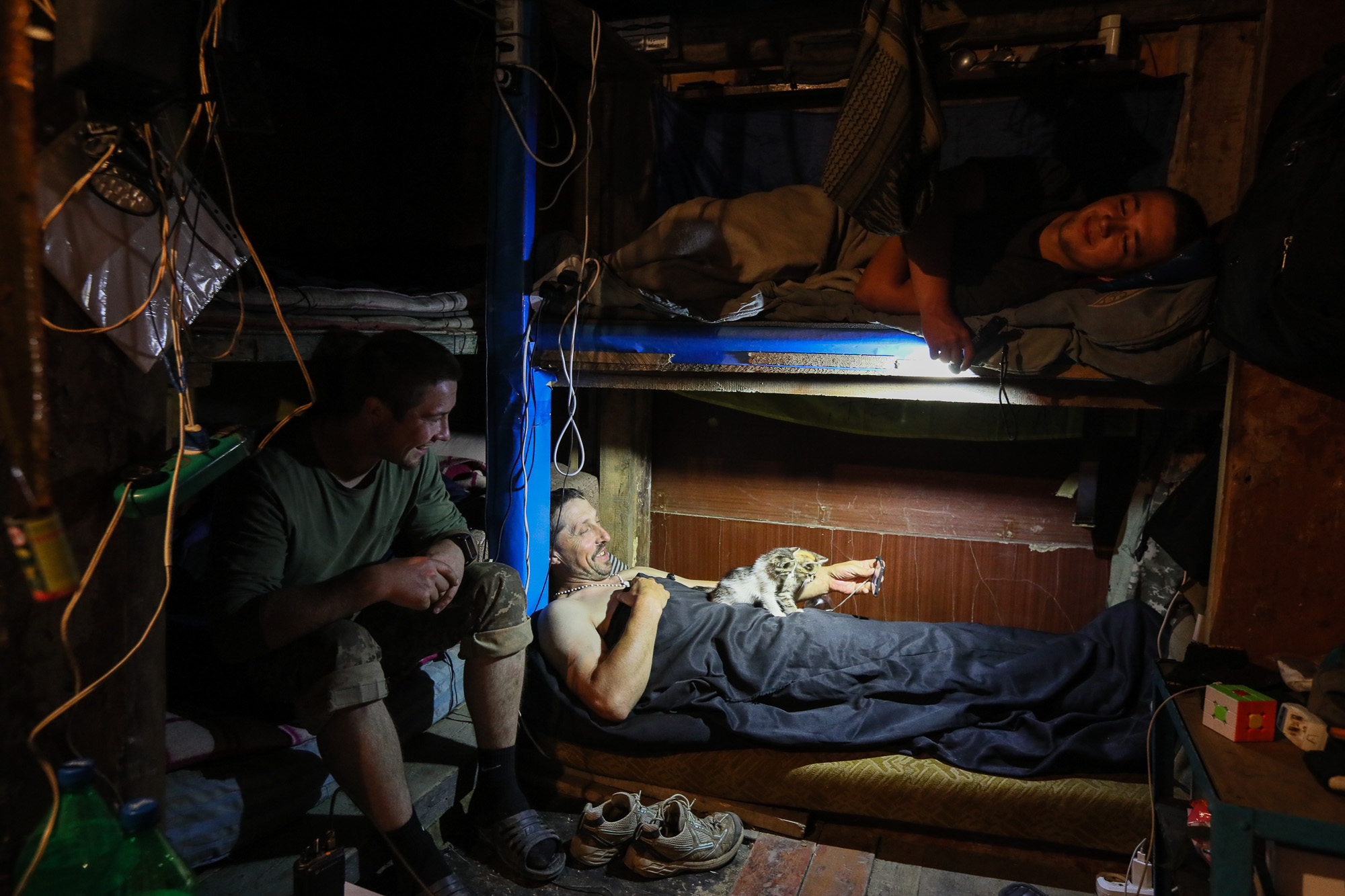 Ukrainian soldiers rest after their combat duty in a barrack in the town of Zaitseve on June 25, 2018.