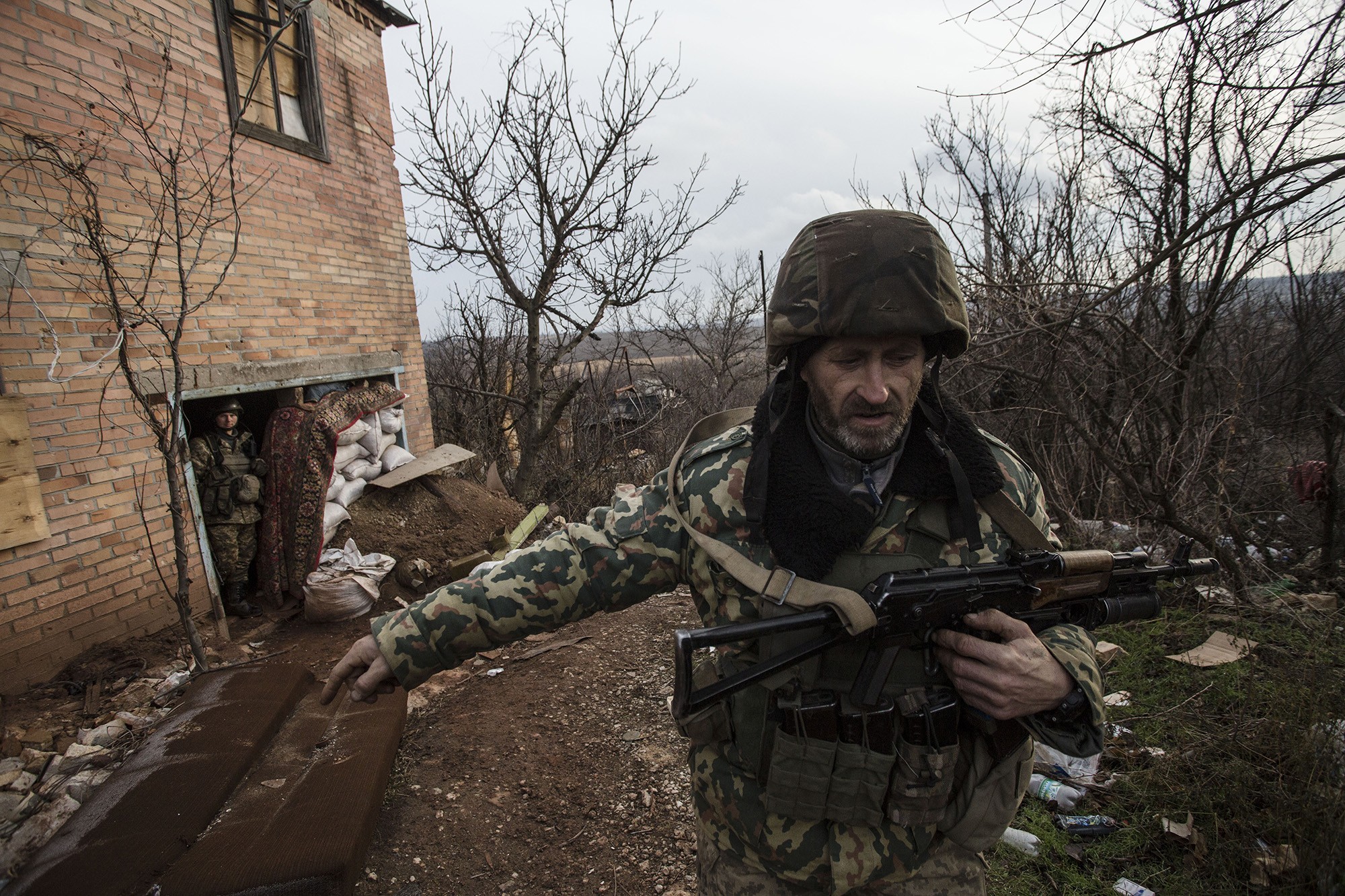 A Ukrainian soldier walks a military redoubt in Verkhniotoretske, Donetsk Oblast on Nov. 29.
