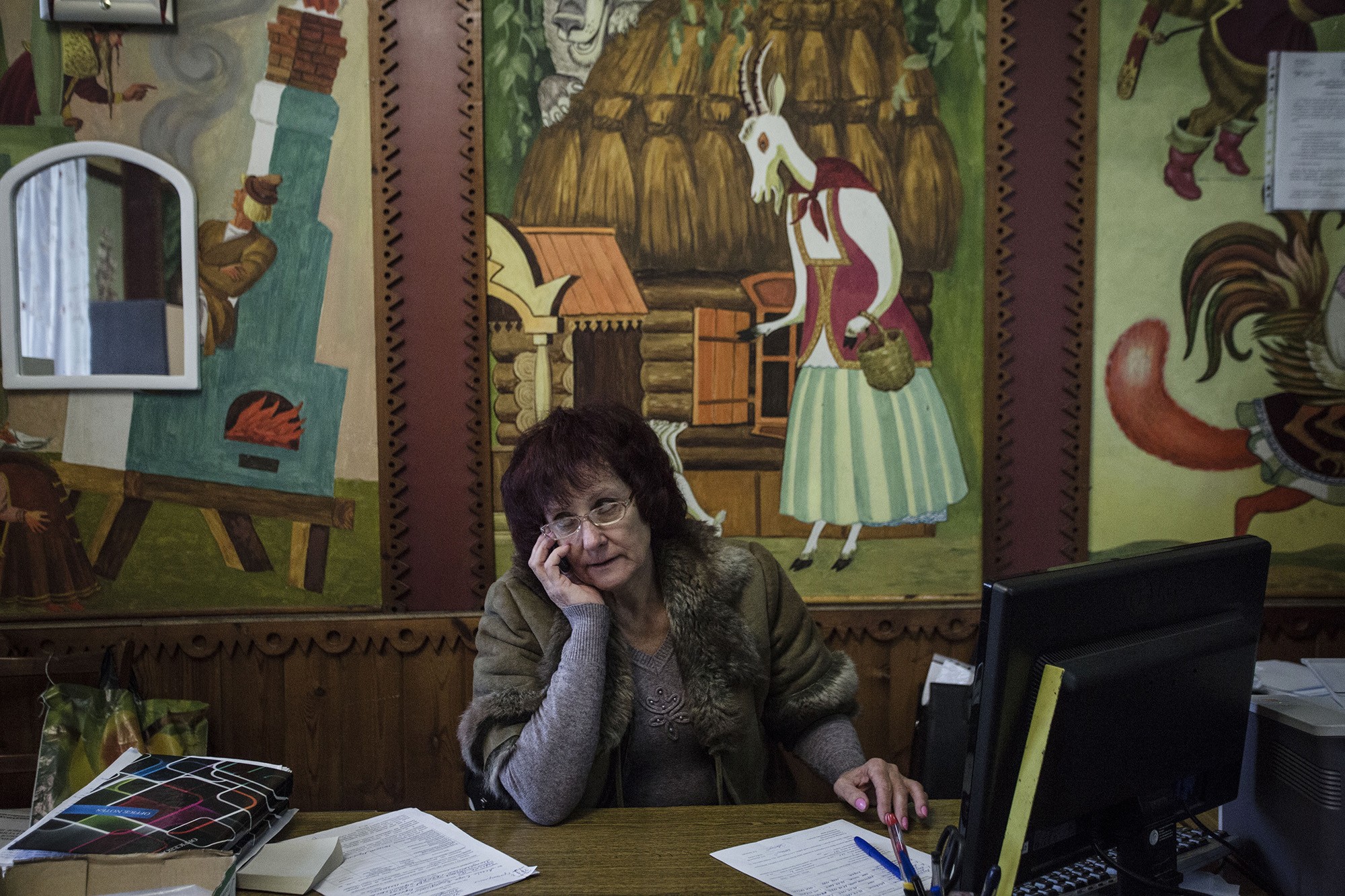 A City Hall worker sits in a Palace of Culture which is now a City Hall in Verkniotoretske, Donetsk Oblast on Nov. 28.
