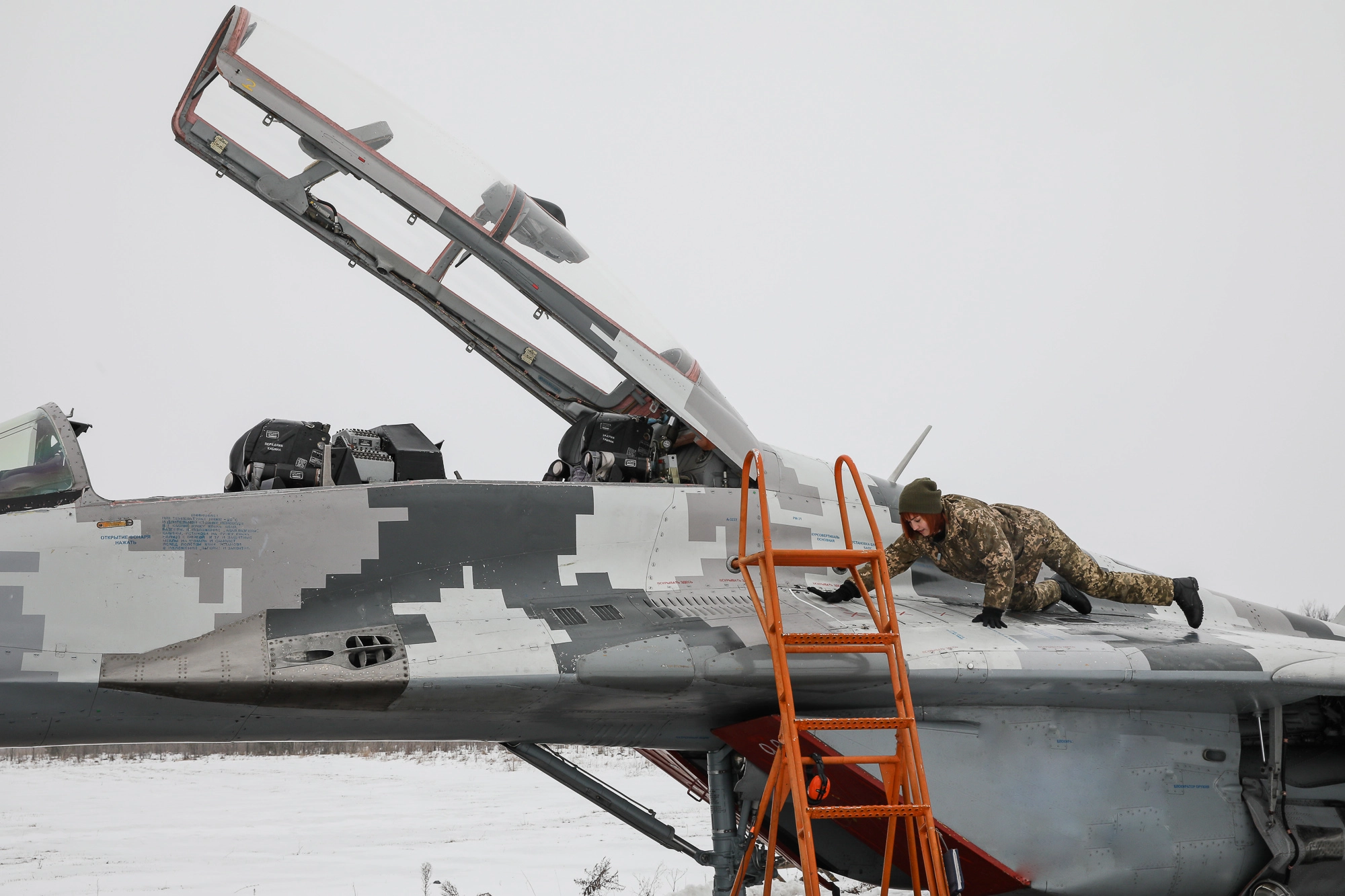 A service technician prepares a Mikoyan MiG-29 fighter for a practice flight at Repair technicians inspect a Ukrainian Air Force&#8217;s L-39 Albatros training plane at an airbase of Vasylkiv on Feb. 14, 2019.