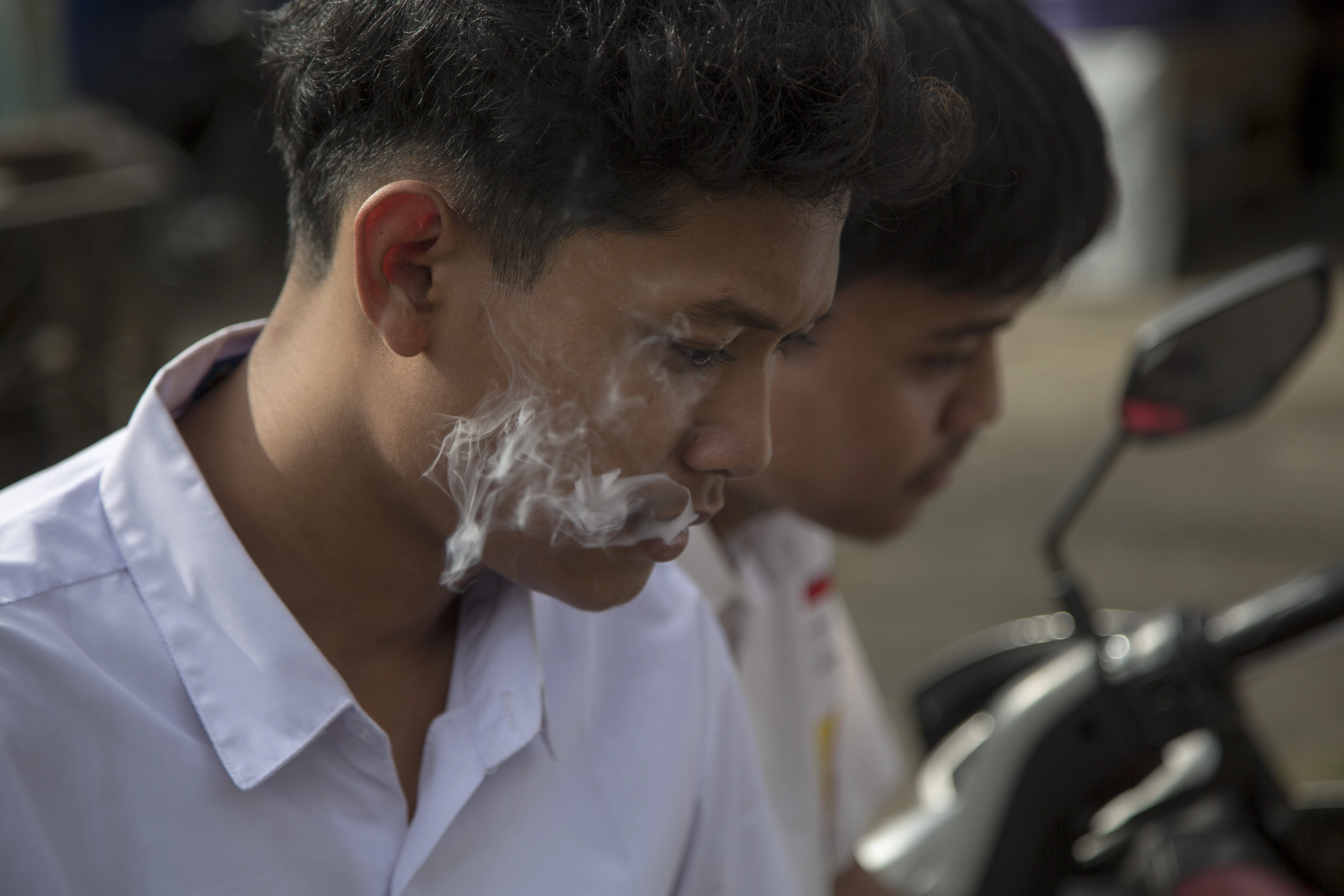 Students smoke cigarretes after school in Bogor, West Java.