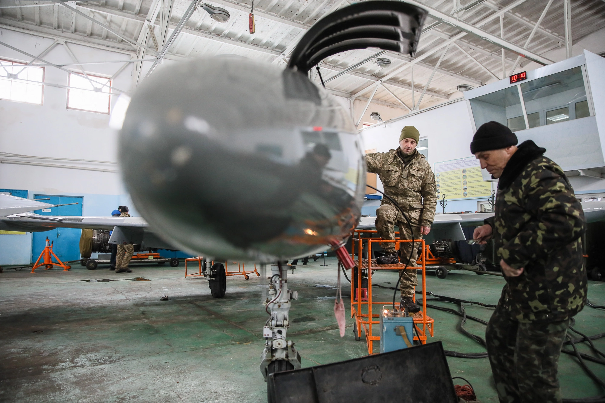 Repair technicians inspect a Ukrainian Air Force&#8217;s L-39 Albatros training plane at an airbase of Vasylkiv on Feb. 14, 2019.