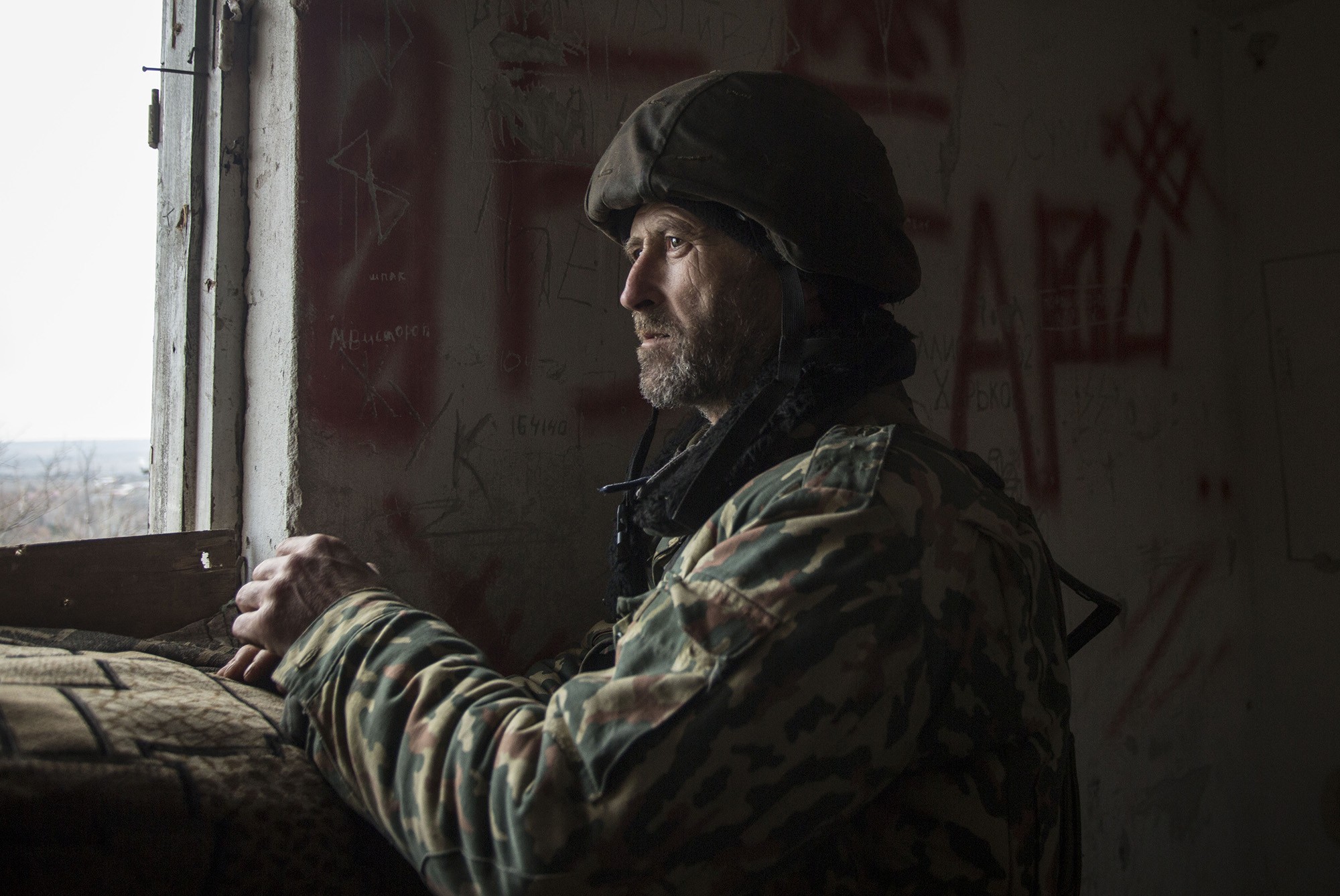 A Ukrainian soldier is on duty in a military redoubt in Verkhniotoretske, Donetsk Oblast on Nov. 29.
