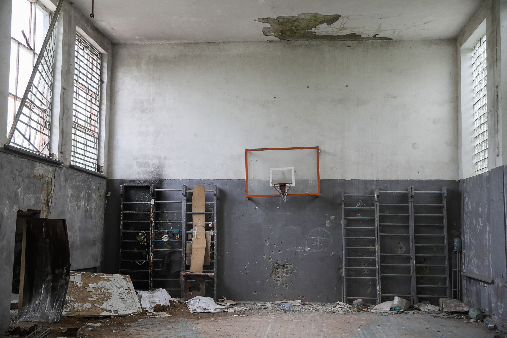 A damaged school gym wall riddled with bullet holes, pictured in the town of Opytne, eastern Ukraine, on June 12, 2019.