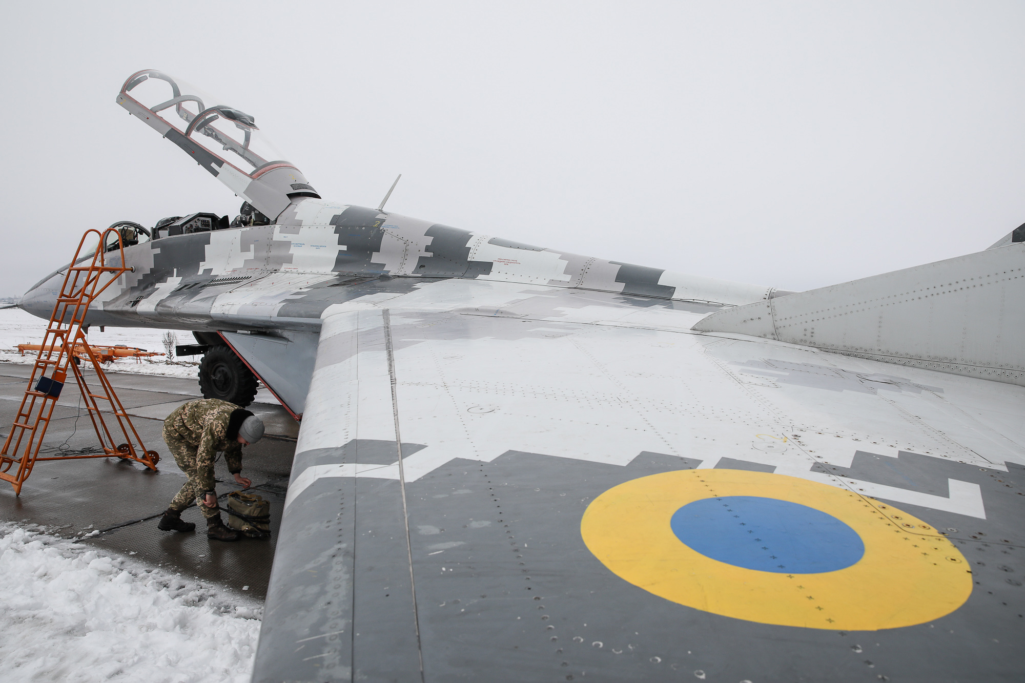 A service technician prepares a Mikoyan MiG-29 fighter for a practice flight at Repair technicians inspect a Ukrainian Air Force&#8217;s L-39 Albatros training plane at an airbase of Vasylkiv on Feb. 14, 2019.
