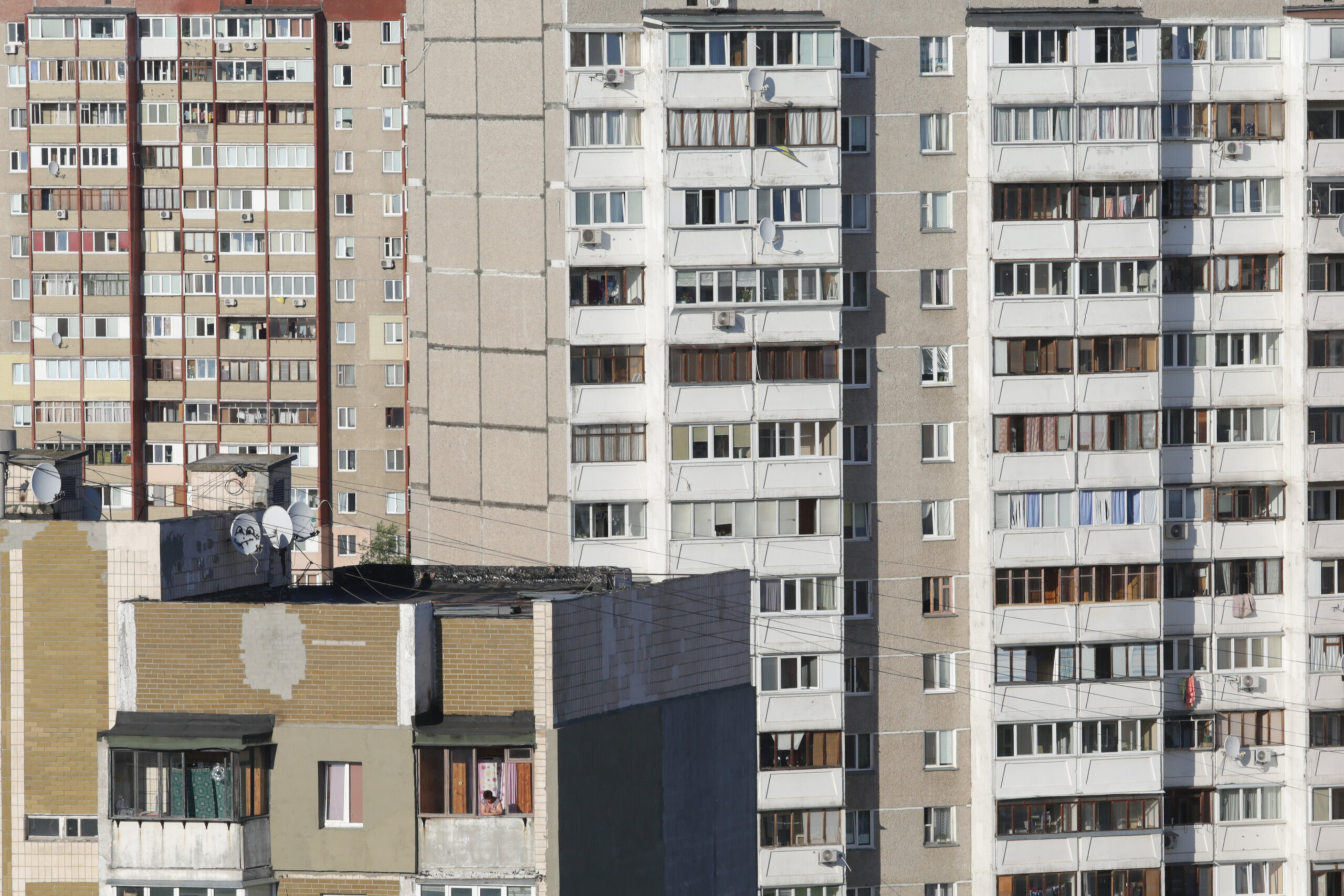 In Kyiv&#8217;s Troieshchyna neighborhood, hundreds of similarly designed apartment buildings stand alongside and behind one another, creating the illusion of an enormous unbreakable grey wall.
