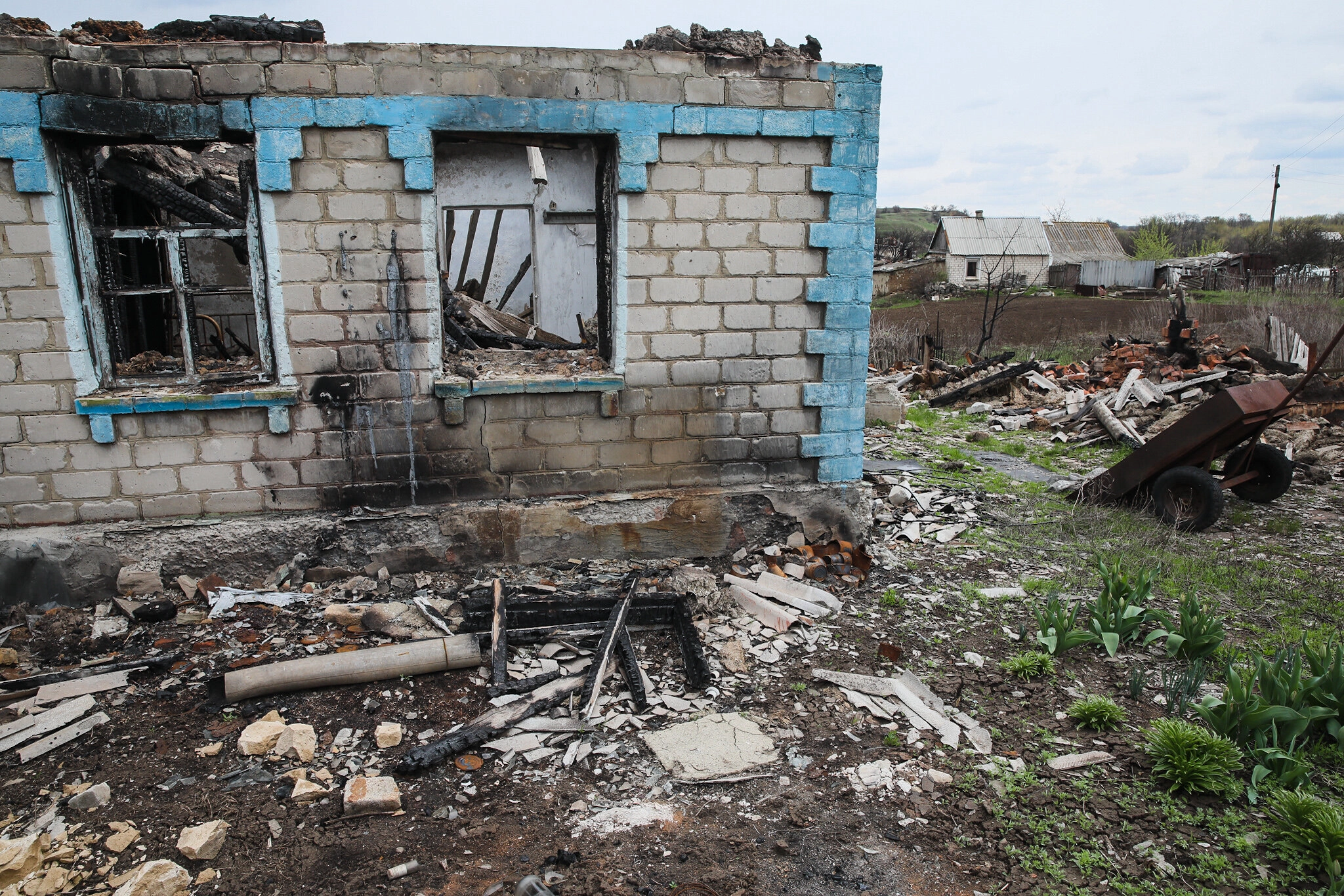 Ruins of a scorched house in the town of Hladosove, pictured on April 27, 2021