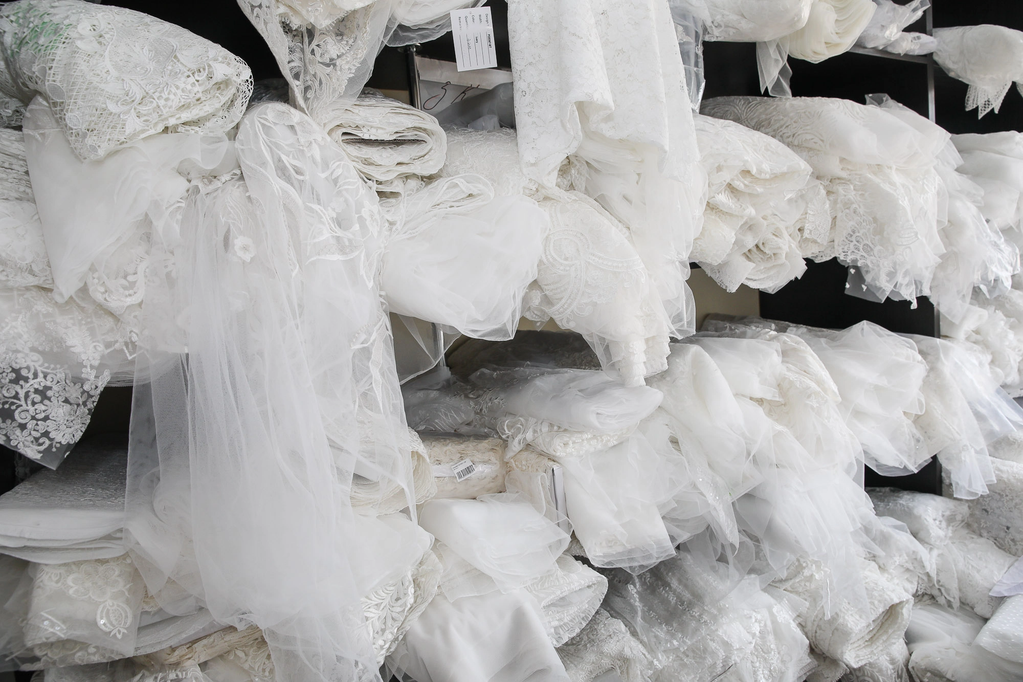 In the warehouse of the company, tons of all kinds of fabrics are laid out for the creation of 2,000-3,000 wedding dresses per month. (Volodymyr Petrov)