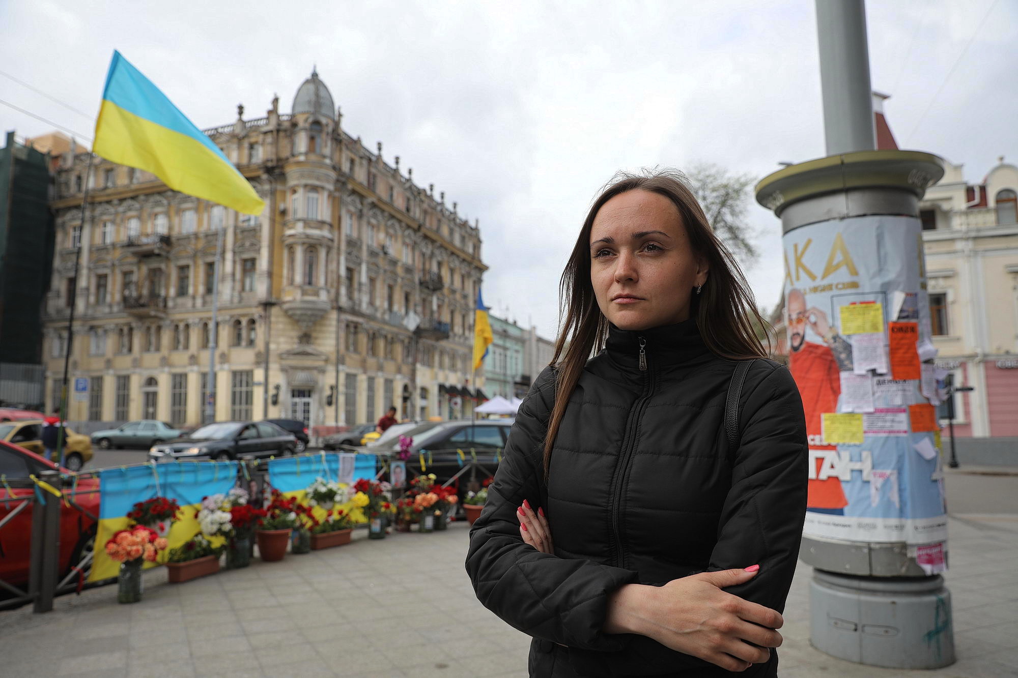 Tetiana Soykina of Right Sector nationalist group stands on May 10, 2019, by the corner featuring portraits of two pro-Ukrainian activists, who were killed in street fights with pro-Russian forces in Odesa on May 2, 2014. One of those killed was Soykina’s friend. 