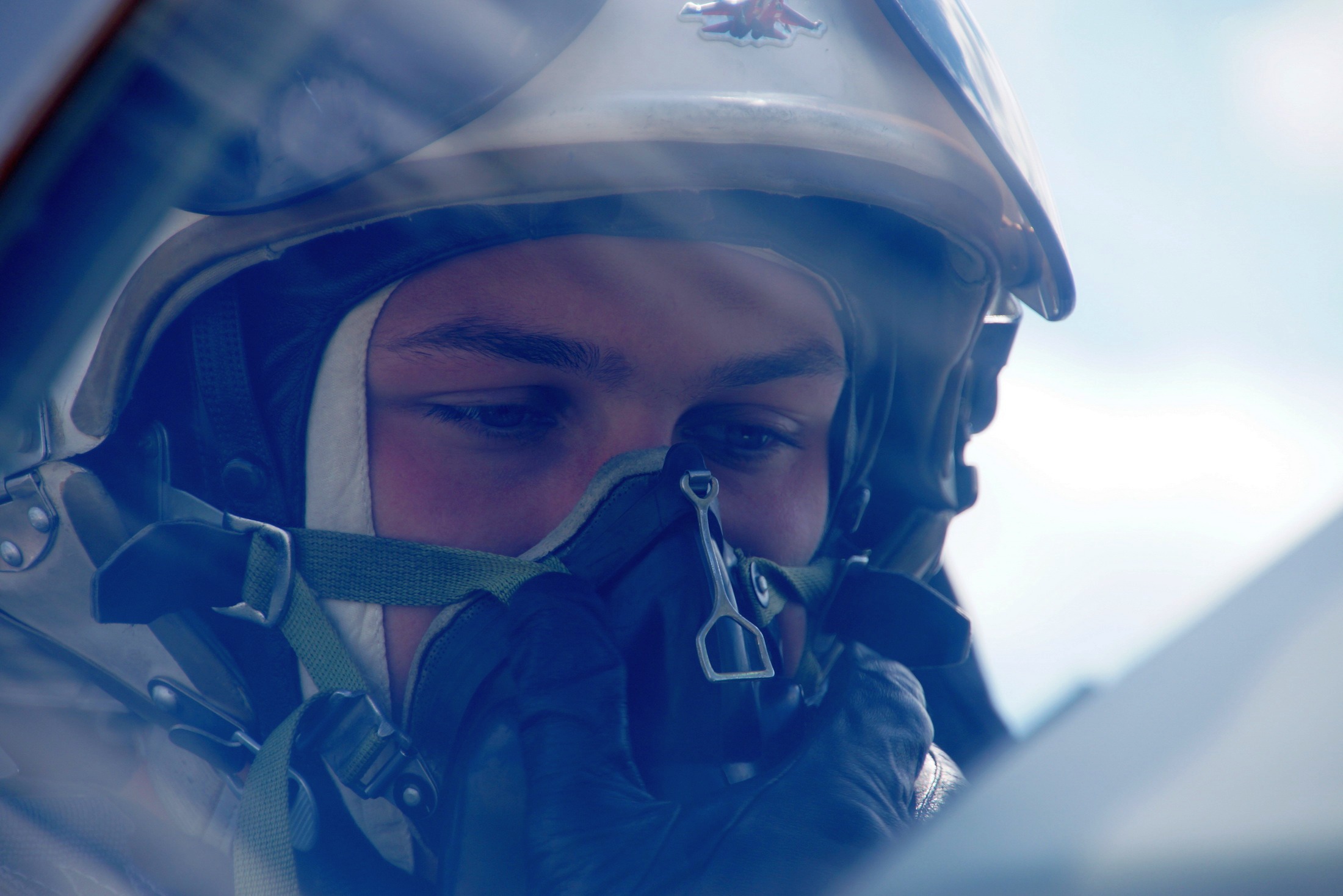 A Ukrainian Air Force pilot adjusts his oxygen mask as he prepares for a training flight on June 7, 2016.