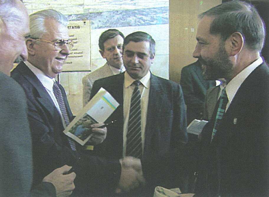 Yevhen Shcherban (R) shakes hands with the first President of Ukraine Leonid Kravchuk around 1994, when both served as lawmakers. 