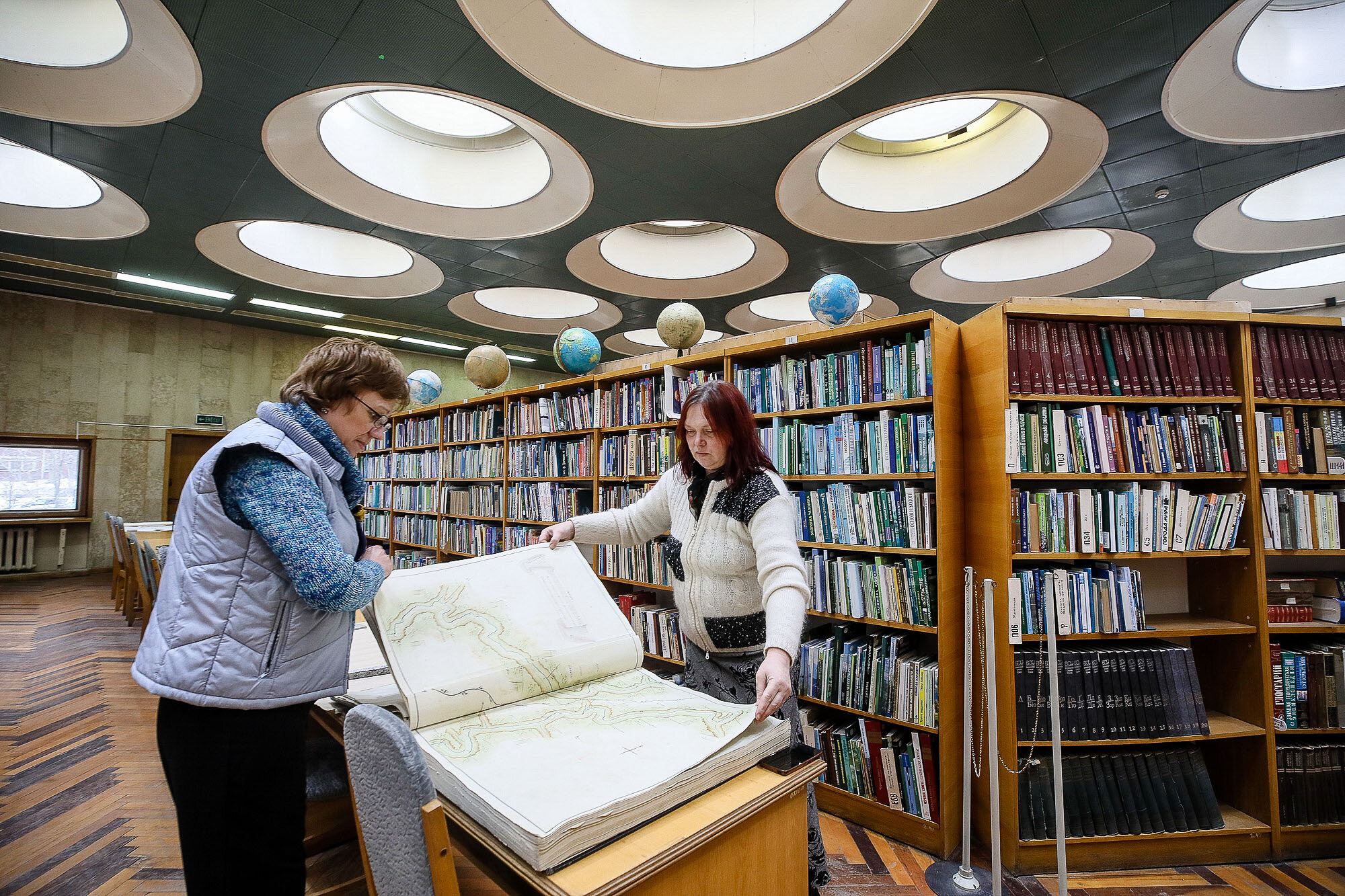 Employees of the Vernadsky National Library show hundreds of years old maps that they look after and exhibit. 