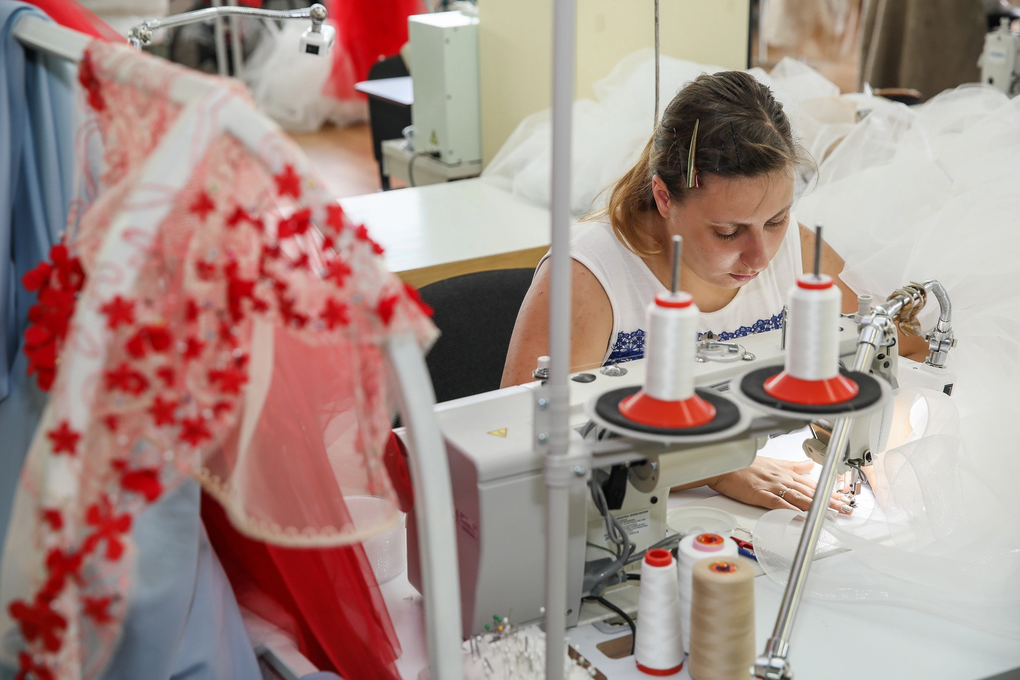 A seamstress works on a new wedding dress. (Volodymyr Petrov)