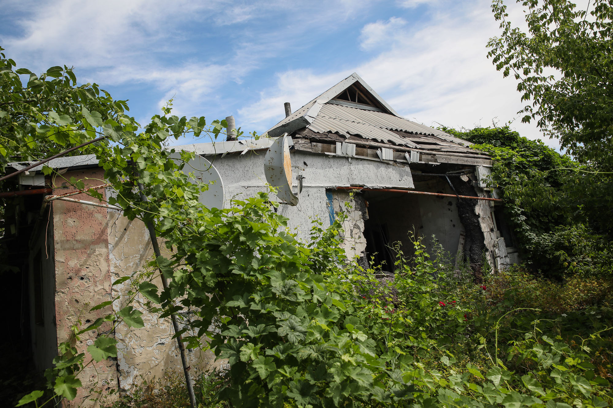 A ruined house in the town of Opytne, pictured on June 12, 2019. 