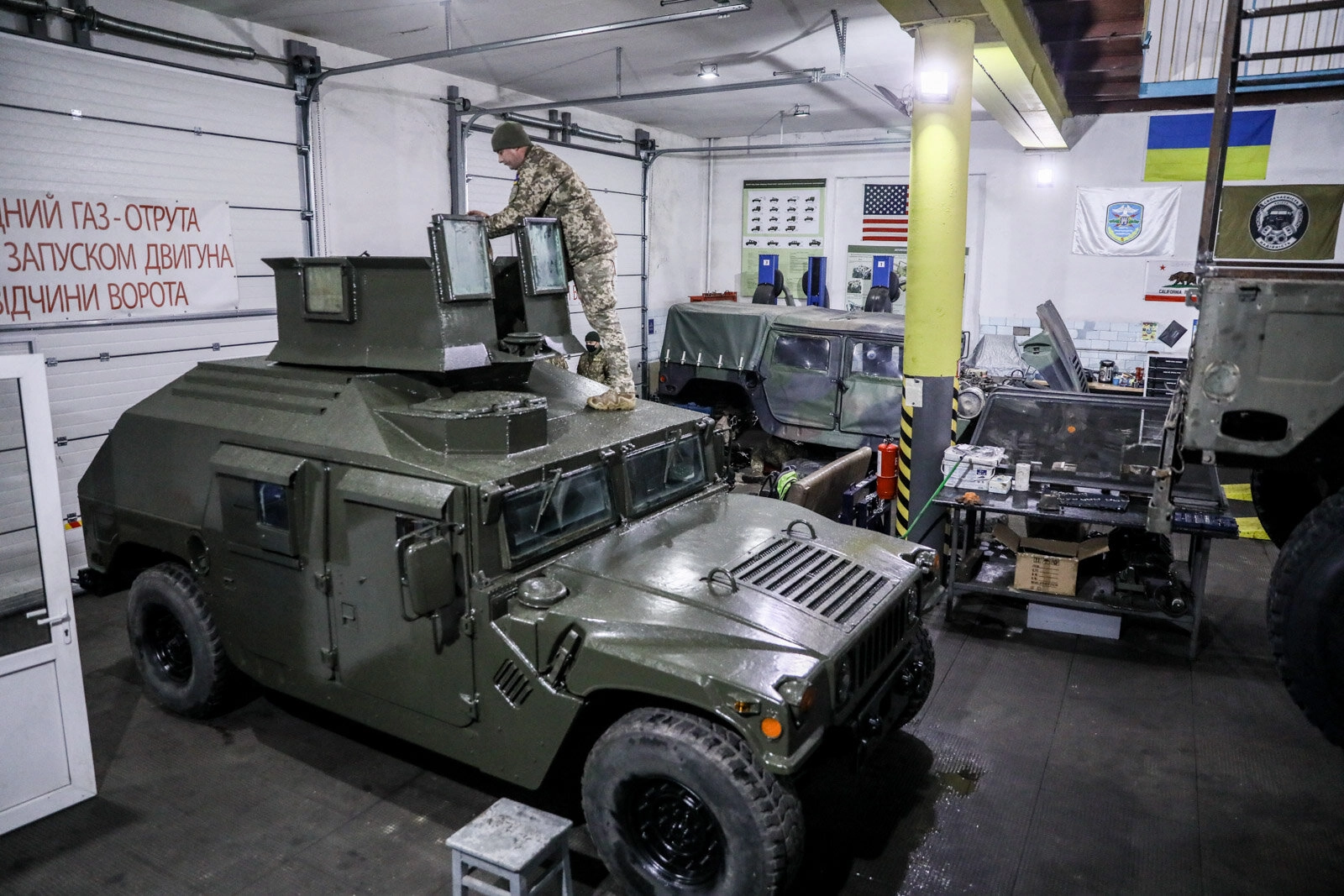 A technician repairs a Humvee vehicle at a Ukrainian army&#8217;s maintenance and overhaul workshop in the city of Zhytomyr on Nov. 20, 2020.