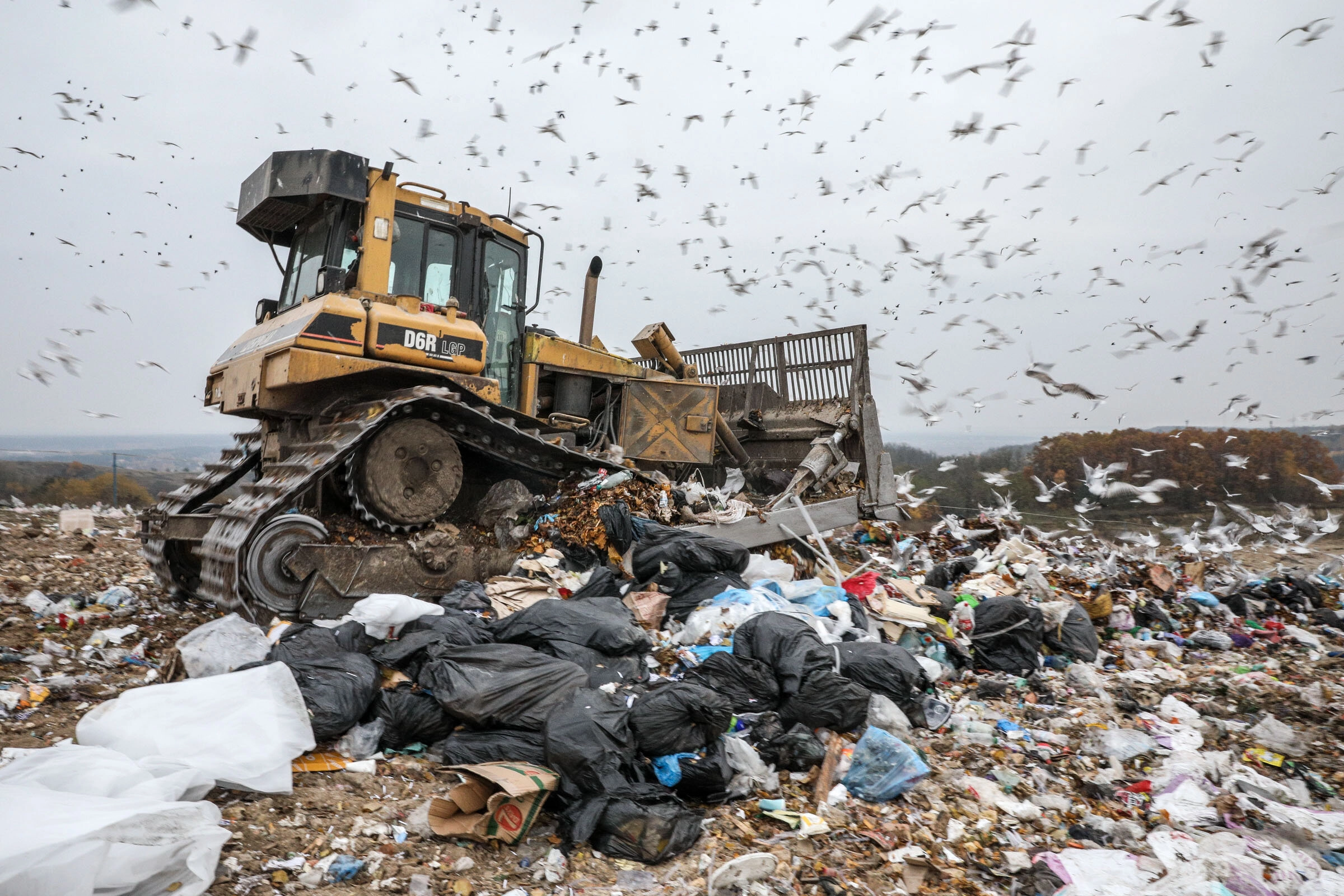 A bulldozer drives at the landfill No. 5 in Pidhirtsi, Kyiv Oblast.