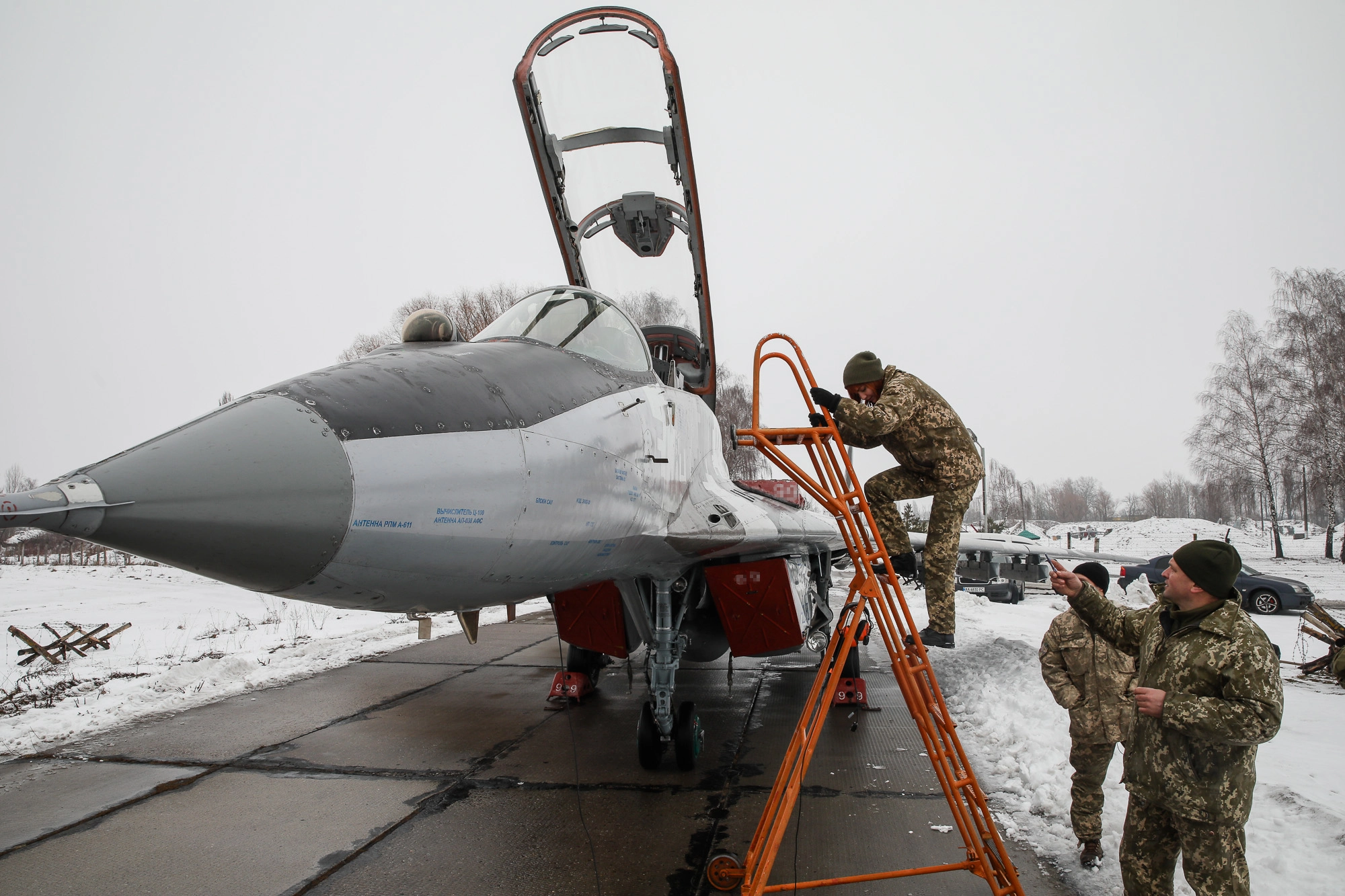 A service technician prepares a Mikoyan MiG-29 fighter for a practice flight at Repair technicians inspect a Ukrainian Air Force&#8217;s L-39 Albatros training plane at an airbase of Vasylkiv on Feb. 14, 2019.