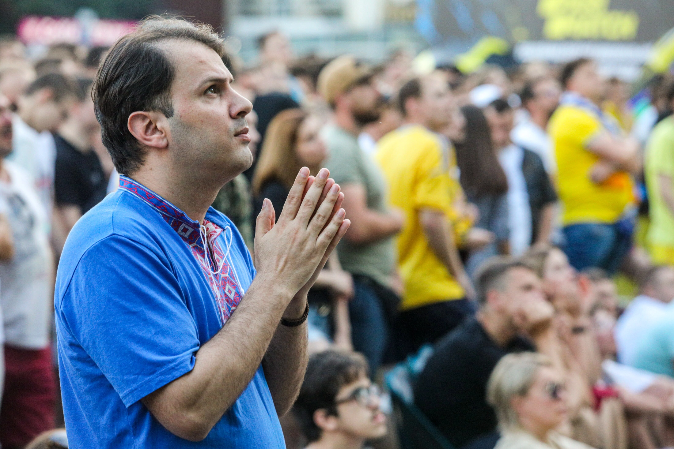 Ukrainian supporter reacts as they watch the  UEFA EURO 2020 Group C football match between Ukraine and Austria on a giant screen in the center of Kyiv on June 21, 2021.